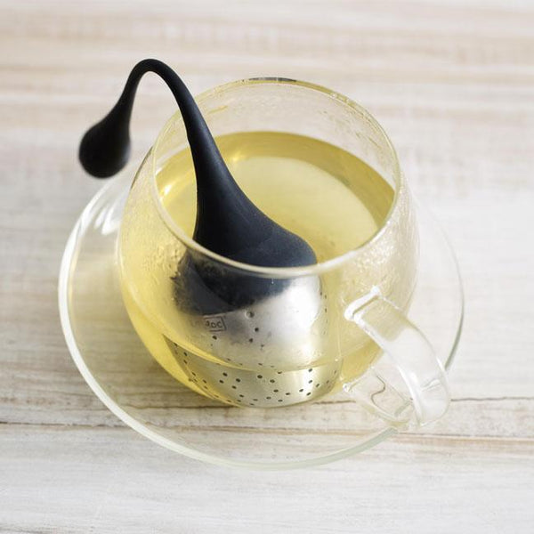 hanging tea infuser in a cup of tea
