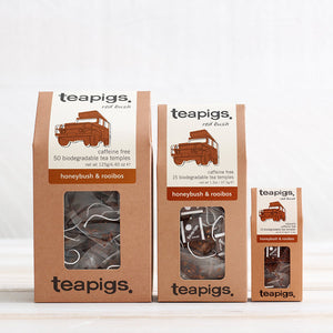 three packs of honeybush and rooibos tea in different sizes