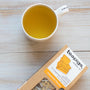 15 pack of Chamomile Flowers teabags next to a cup of tea