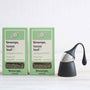 black floating tea strainer and packs of loose peppermint tea